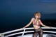 A woman in lingerie posing on the deck of a cruise ship.