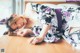 A woman in a kimono laying on the floor.