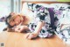 A woman in a kimono laying on the floor.