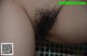 A close up of a woman's hairy ass.