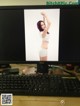 A computer monitor with a picture of a woman on it.