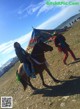 A woman riding on the back of a brown horse.