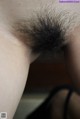 A close up of a woman's hairy ass. 