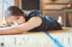 A young girl laying on the floor in a room.