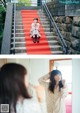 A woman sitting on a red carpeted stairway next to a mirror.